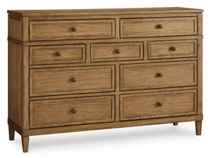 Taking a timeless approach to bedroom beauty, this dresser brings easygoing elegance to the everyday. With its light brown wood tone, it seamlessly slips into your roomâ€™s aesthetic. Dark bronze-tone pulls accent the assorted storage drawers, adding to t