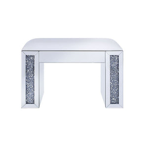 The Noralie Vanity Stool will give any room a touch of glamour. This contemporary stool is upholstered in an elegant bone PU fabric and is fully mirrored with a faux diamond inlay on each leg of its sled base. Use this unique vanity stool for make-up appl