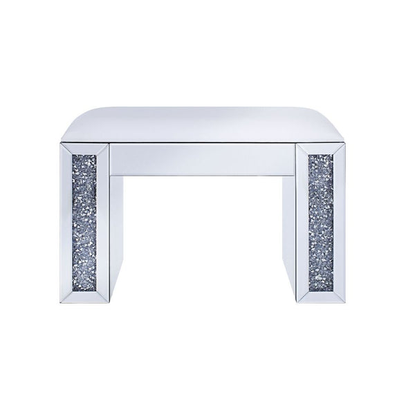 The Noralie Vanity Stool will give any room a touch of glamour. This contemporary stool is upholstered in an elegant bone PU fabric and is fully mirrored with a faux diamond inlay on each leg of its sled base. Use this unique vanity stool for make-up appl