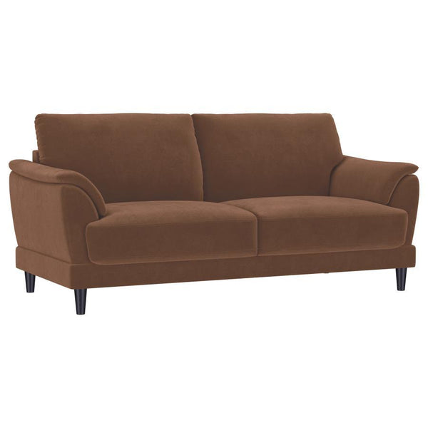 Unwind in style with this chic retro-inspired sofa, designed to deliver both comfort and timeless elegance. Upholstered in a rust woven fabric, it features plush foam seat cushions and curved tufted arms for ultimate support. The fully encased engineered 