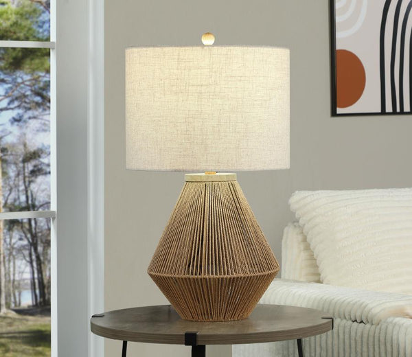  it adds a touch of organic charm to any space. The neutral fabric drum shade diffuses light 