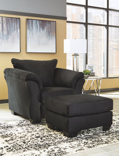 For a fresh spot in your space, turn to this designer chair and ottoman. Wind down at the end of a long day when you sink into this canyon of comfort. <h4><b>Darcy - Black - Chair</b></h4> <table width=-"100%-"><colgroup><col style=-"width: 30%