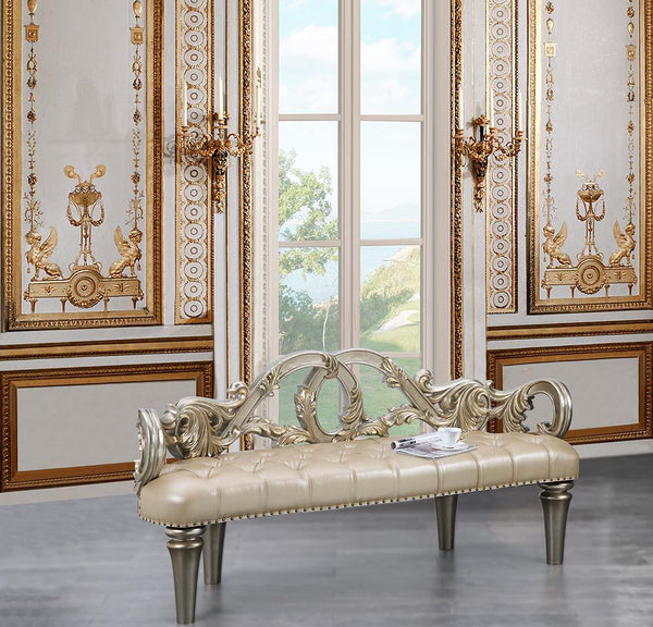 Feast your eyes upon the decadence and true luxury of the Danae collection of furniture! This striking bed defines opulence! Created to make a statement, this regal bed invites you to hold court in its divine carved curves and details. The Champagne finis