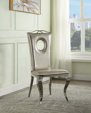 The Cyrene side chairs offer a showstopping shiny chrome base that offsets virtually any color scheme. The plush foam padded seat and backrest are designed for maximum comfort. The chairs are upholstered in a beautiful beige pearlized faux crocodile fabri
