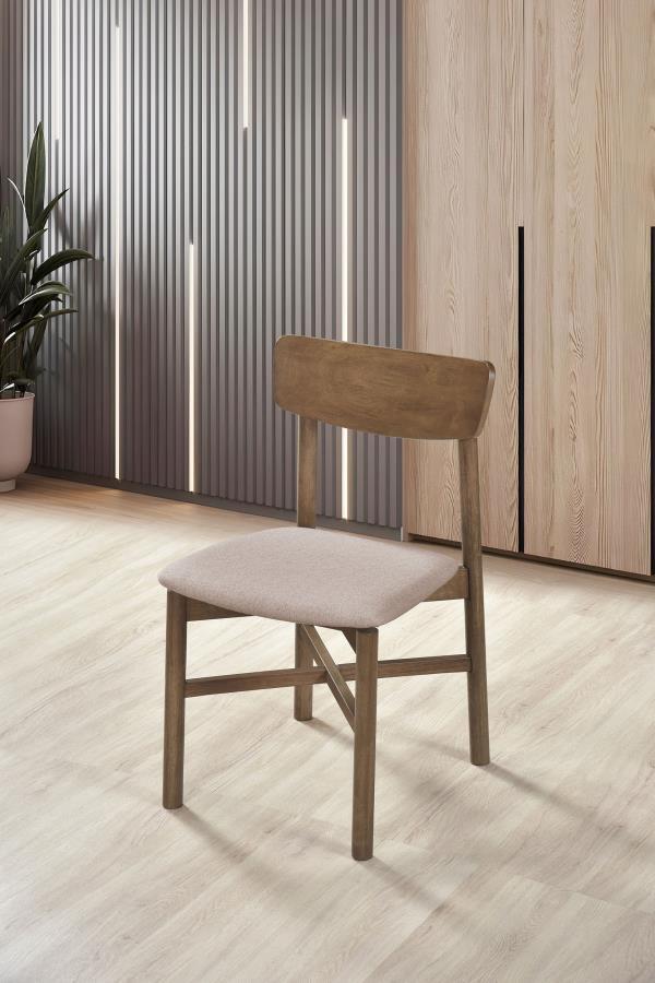 Bring a touch of simplicity and comfort to your dining space with this stylish chair. Designed with a minimalist appeal, the chair is crafted from a mix of solid wood and engineered wood for both durability and a natural aesthetic. The tan fabric upholste