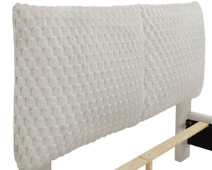 This luxurious bed is the centerpiece of a serene and sophisticated bedroom oasis. It features an opulent