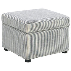 This versatile storage ottoman enriches your living space with stylish functionality. Upholstered in soft, neutral fabric, its hydraulic lift top reveals hidden storage perfect for stashing blankets, magazines, or personal essentials. Use as a footrest, e