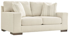 Classic comfort gets a mod twist with this loveseat. Its minimalistic approach and structured silhouette bring a clean-lined design element to your living room. Sink into the positively plush cushions while relaxing solo, or curl up with a glass of wine w