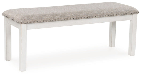 The Robbinsdale dining bench is sure to impress come mealtime. With its antiqued white finish and light gray upholstery with nailhead trim, modern farmhouse-style dining has never been so fashionable. All that-'s missing is you and your family.<br/><br/><