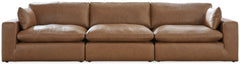 Catering to your contemporary lifestyle, this sectional sofa is a handsome marriage of masculine and feminine sensibilities. Feather-fiber cushions and bolster pillows soften the look of its chunky, linear silhouette. A warmly hued combination of leather 