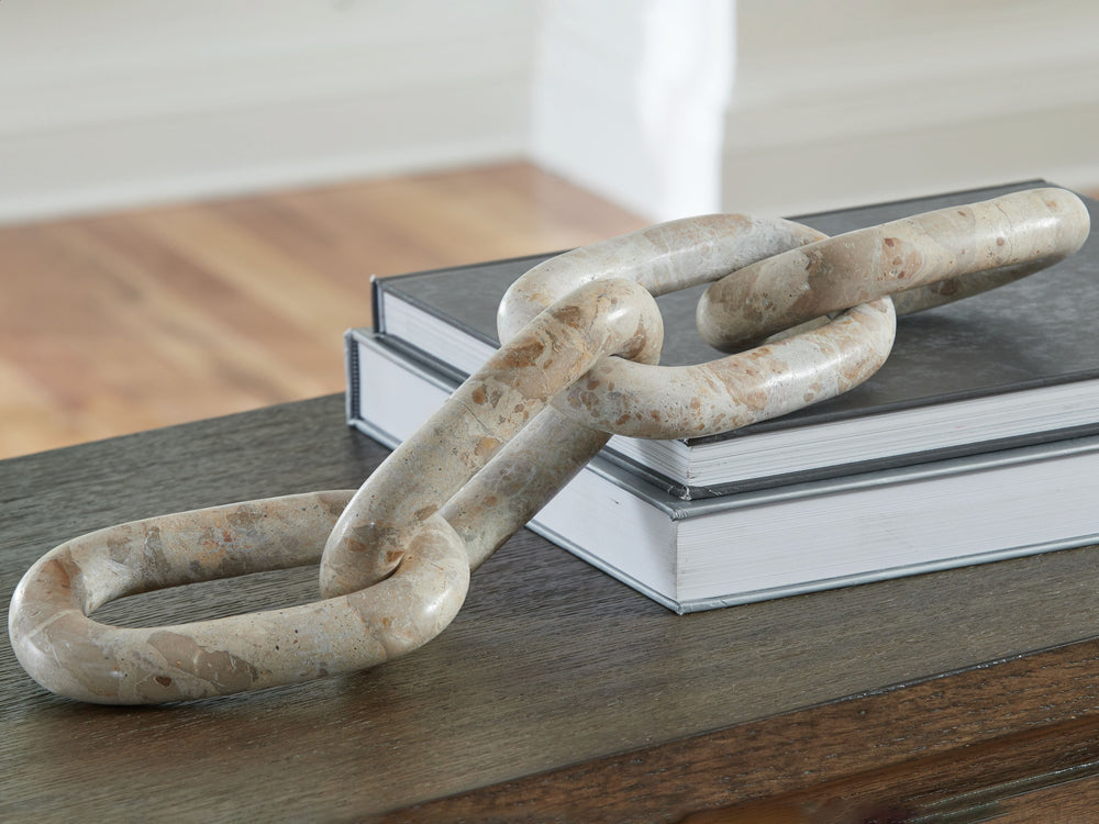 Striking from every angle, this sculpture connects you with some casually cool art. Its interlocking light beige marble links add a chill vibe to your decor. Adorning a shelf or as a statement piece on its own, itâ€™ll bring home the prize wherever itâ€™s