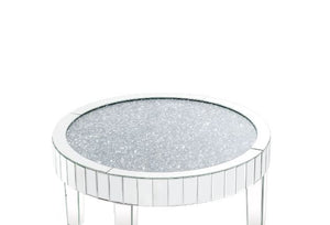  clean-lined silhouette accented by faux diamonds and mirrored finish. Adding depth and dimension to your room while upping the wow factor in your home. This Ornat Coffee Table is ideal for displaying your precious family photos