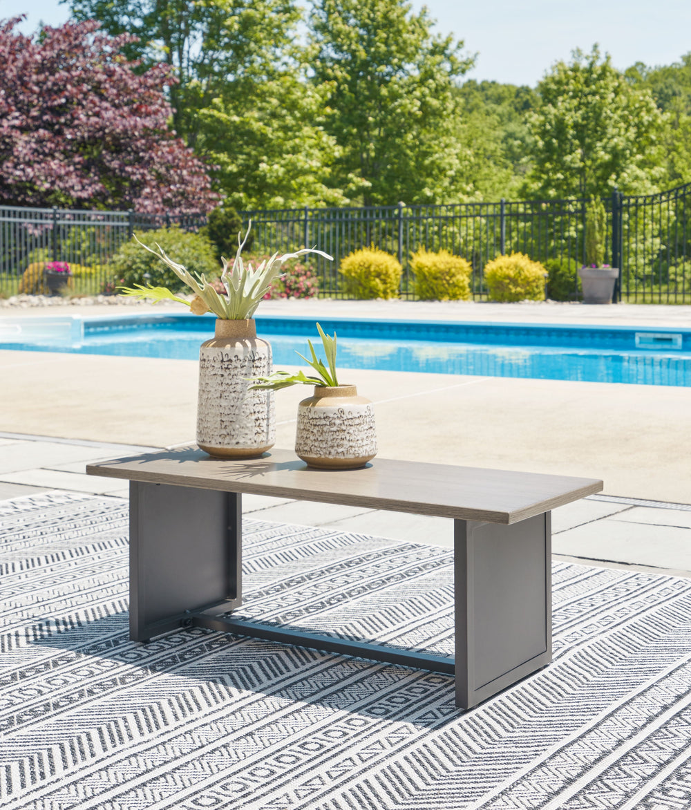 This end table seeks to bring serenity to your outdoor seating area. Channeling Japandi and casual contemporary aesthetics, its minimalist profile encourages laid-back living without sacrificing sophistication. An ideal spot to rest a poolside read, this 