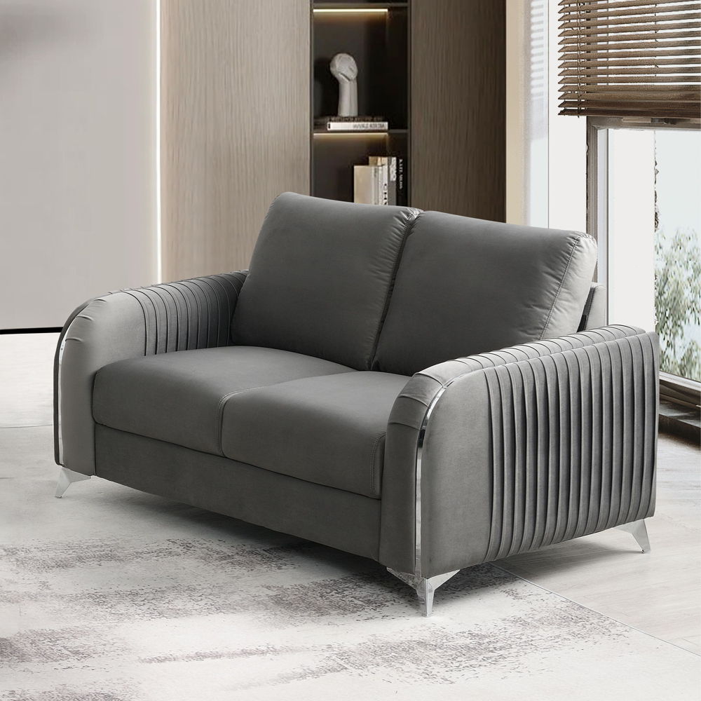Make a bold statement with the Wenona blue velvet loveseat. The blue color of the velvet upholstery is a classic color that will provide a fun pop of color in any home. This loveseat is highlighted with polished chrome trim accents along the armrests and 