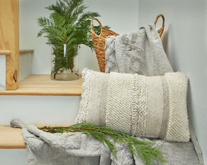  this artful pillow is the epitome of casually cool design. Varying patterns and hues create an irresistibly charming look. What an effortlessly chic way to say