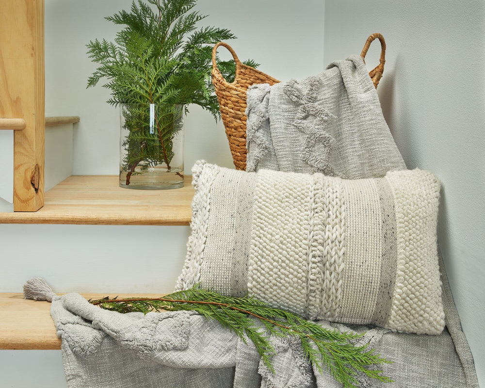 Teeming with tantalizing texture, this artful pillow is the epitome of casually cool design. Varying patterns and hues create an irresistibly charming look. What an effortlessly chic way to say, -"Welcome home.-"<br/><br/><b>Product Features</b><ul><li>Fa