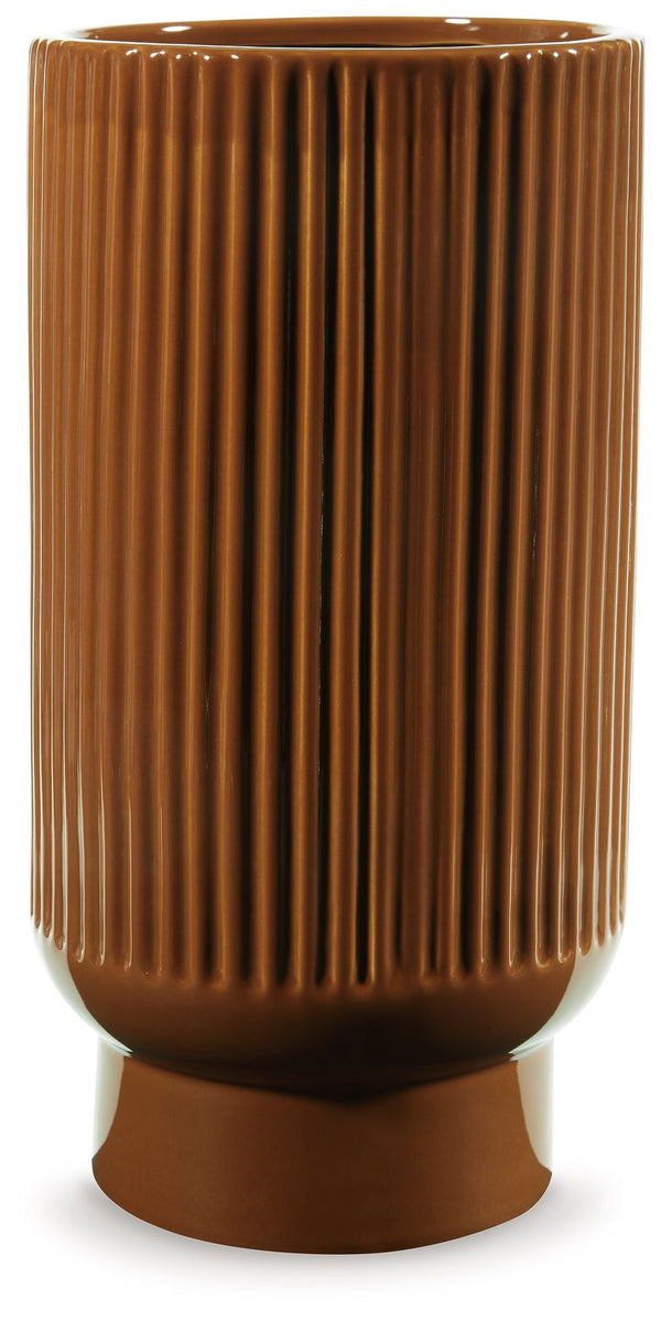 This ceramic vase makes a relaxed style statement. Its casual design and earthy burnt umber glaze complement your laid-back sensibilities. Delightfully simple and simply delightful, this vase subtly wows on its own or when filled with your favorite flower