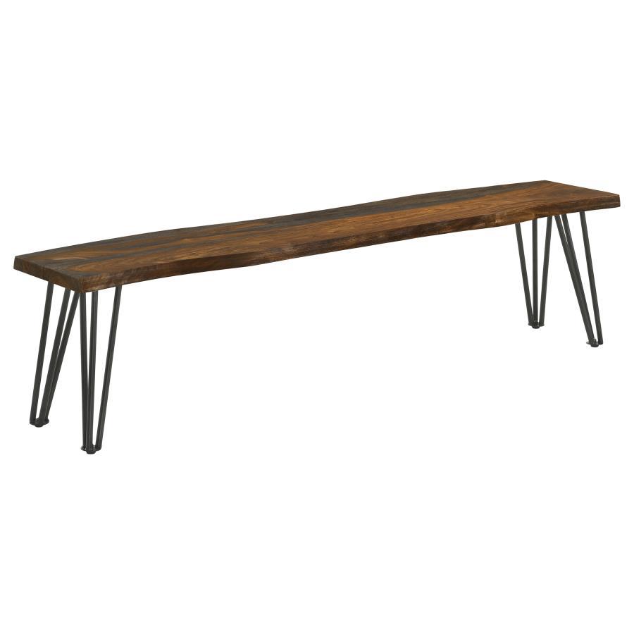 Present plenty of seating at your transitional dining table with this rustic industrial dining bench, featuring a long solid sheesham wood seat covered in a grey finish complete with a live-edge detail that gives a natural touch. Gunmetal finished hairpin
