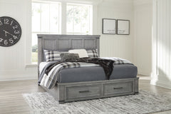 With its light weathered gray coloration, this storage bed conveys trend-right urban farmhouse style. Thick-profiled top moulding on the tall, mansion-scale headboard lends a fresh take on a timeless design. The footboard features two storage drawers with