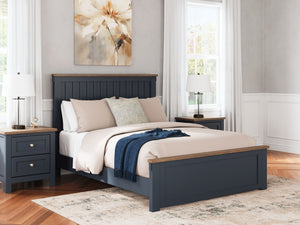  this queen panel bed pairs a dark slate blue finish with light brown accents. The slatted headboard in a classic Shaker style brings an air of beautiful simplicity to the 