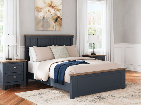  this queen panel bed pairs a dark slate blue finish with light brown accents. The slatted headboard in a classic Shaker style brings an air of beautiful simplicity to the 