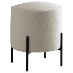 Minimal and playful, this modern ottoman offers extra seating in a contemporary style home. Wrapped in soft, plush upholstery, it provides a bright, airy touch to any space. Supported by slim, rod-like metal legs in a matte finish, this round ottoman cont