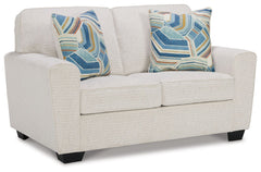 Need a simple style refresh? Liven up your living room essentials with this loveseat. A chunky silhouette holds invitingly ample cushioning you-'ll long to lounge in. Crosshatched upholstery and accent pillows give the otherwise casual design a delightful