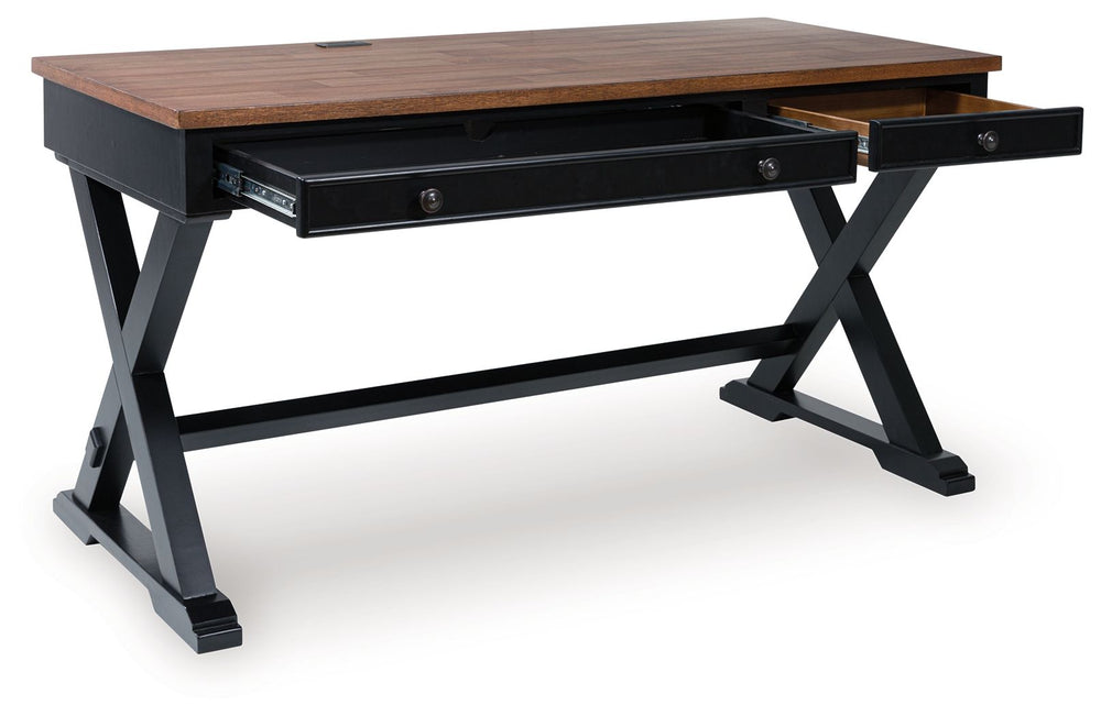 Raise the bar on modern farmhouse style with this home office desk. Its casual good looks are accentuated with a two-tone finish, which pairs a warm satin black base with a contrasting butcher block veneer desktop. The drop-down keyboard and cord manageme