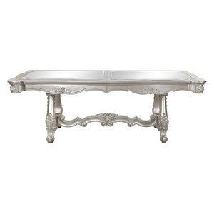  the Devayne double pedestal dining table brings in all the allure and charm that you are seeking for a dining table. The table features an extension leaf that allows for additional dinner guests. The champagne finish enhance