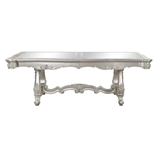  the Devayne double pedestal dining table brings in all the allure and charm that you are seeking for a dining table. The table features an extension leaf that allows for additional dinner guests. The champagne finish enhance