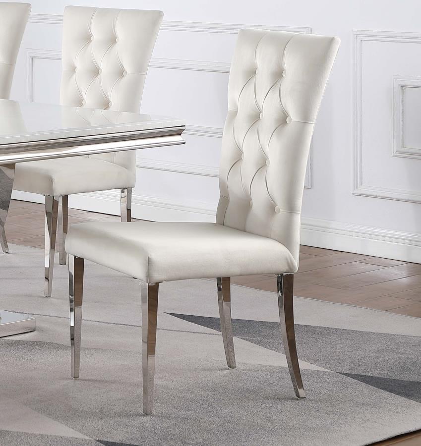 Transform your dining area into a chic space with this elegant, modern glam side chair set. Designed in a classic Parson style silhouette, these two chairs boast a tall curved back for extra comfort and support throughout long dinners. Upholstered in a pl