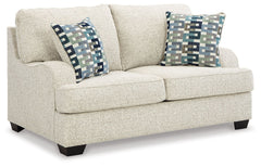 This loveseat has the corner on casual contemporary style and everyday comfort. Chic and subtly innovative, its crosshatched chenille upholstery is a forward-thinking take on fashionable neutrals. The sleek frame gets a soft, streamlined touch with slopin