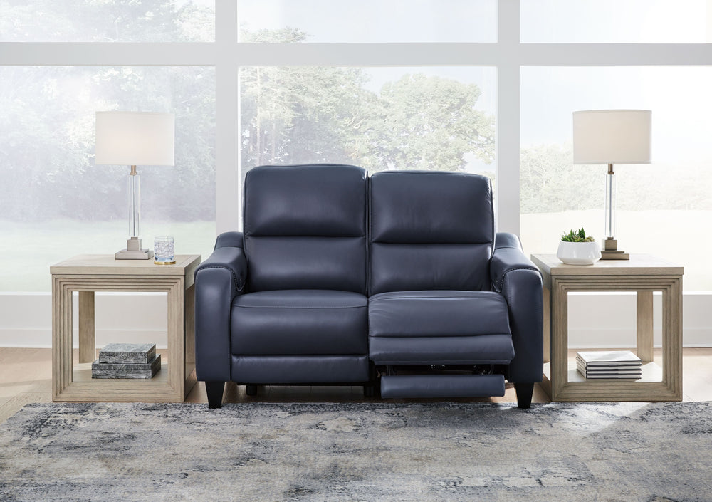 This power reclining loveseat puts a sleek twist on laid-back living. It satisfies your desire for comfort without being bulky in design, thanks to subtly incorporated one-touch reclining and adjustable headrests. With chic exposed legs and stunning stitc