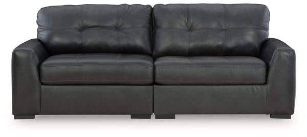 Discover lasting luxury with this sectional loveseat. You-'ll experience the perfect blend of comfort and stylish design with its combination of leather and faux leather. Featuring tufted detailing and low-profile legs, this must-have loveseat ensures bot