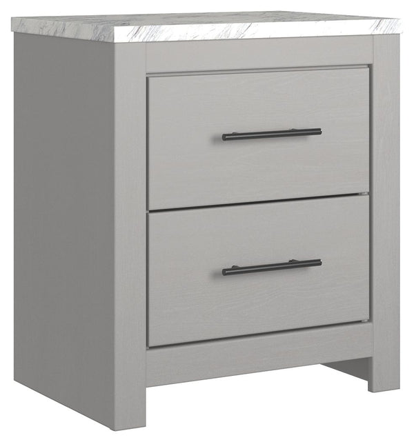 Cool, clean and casually modern. This nightstandâ€™s wispy dove gray finish and faux Calcutta marble top set the tone for your calming sanctuary. Large linear pulls add dimension and authenticity. Two smooth-gliding drawers neatly accommodate your bedside