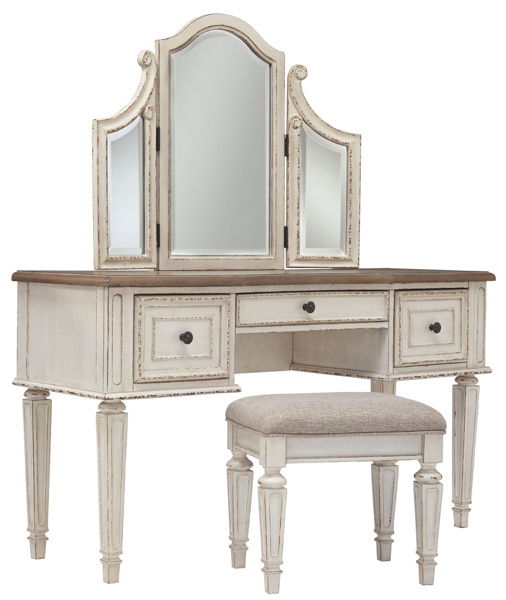 Elevating the art of traditional cottage styling, this 3-piece vanity set is your dream bedroom retreat realized. Its antiqued two-tone aesthetic blends a chipped white with a distressed wood finished top for added charm. Framed drawer fronts and a plushl