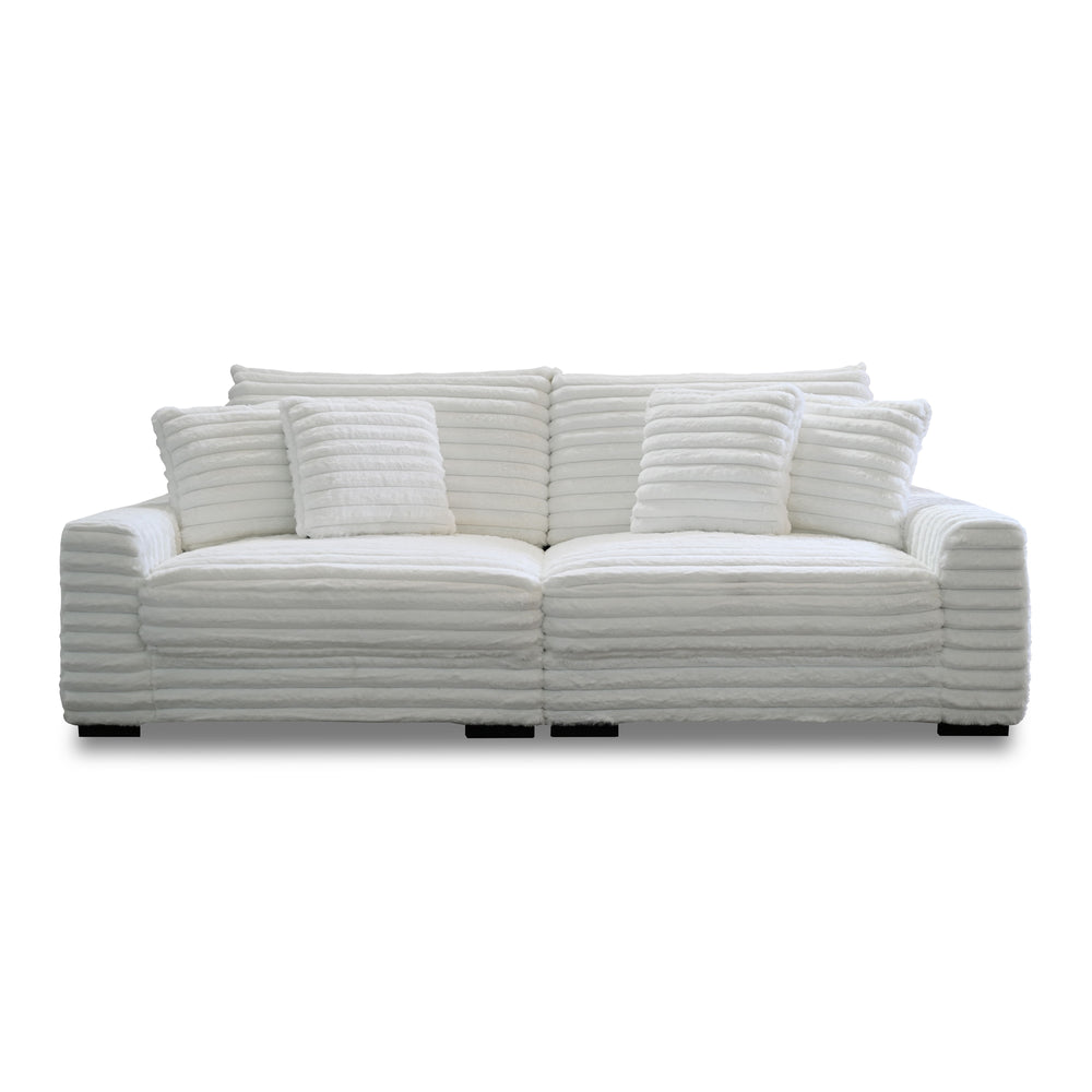 This two-piece Embrace sofa in white is designed to transform your living space into a haven of comfort and style. Made from 100% polyester fabric with a plush, blanket-like texture, it promises ultimate relaxation. The set includes a right arm facing cha