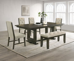 Bring a perfect blend of style and comfort to your dining space with this beautifully designed set. Featuring a sleek, dark-finished table with a sturdy trestle base, it provides a durable and inviting surface for everyday meals and gatherings. The uphols