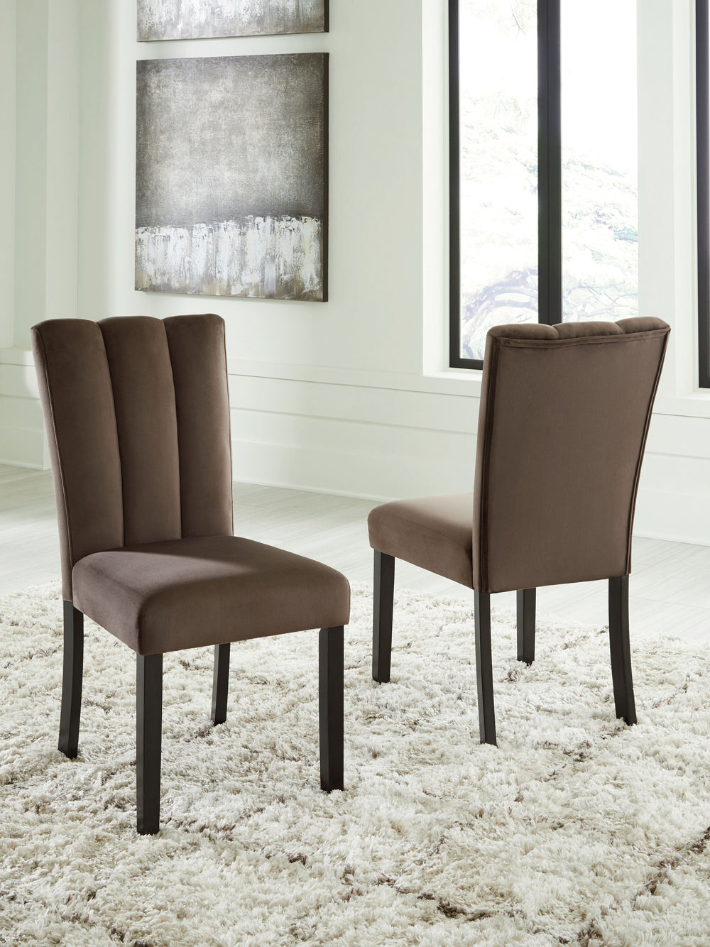 This dining chair reflects your highly contemporary point of view. Its ultra-soft velvet upholstery in chocolate brown is a feast for the senses. Channel stitching details give the chair an elevated, tailored feel. What a delicious choice for an elegantly