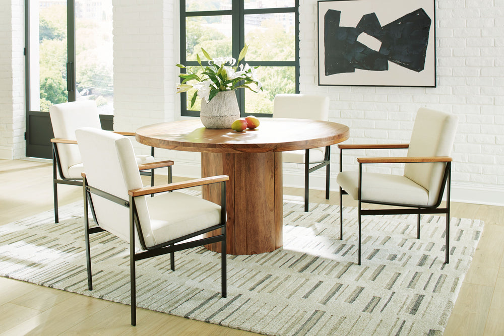 Urban Contemporary design. Made with solid Shesham wood, veneer and MDF substrate. Finished in a clear natural wood tone to enhance the rich natural beauty of the wood. Round dining table features a thick solid wood top set on a sturdy round pedestal for 