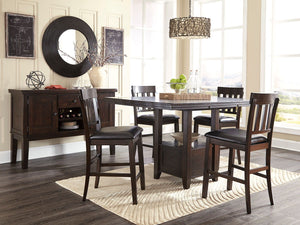 Made with select Oak veneers and hardwood solids with a dry smoky dark brown oak color. Edges and corners have a rounded off, worn effect for a casual look. Server has fully finished drawer boxes with ball bearing side guides. Sturdy looking knobs have de