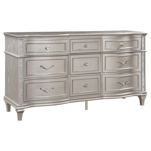 A silver oak finish creates an elegant touch to this glam nine-drawer dresser. Hexagon-shaped knobs and drop bail handles appointed with pearl accents adorn each of the nine spacious drawers for a luxurious look and feel. Keep delicate essentials organize