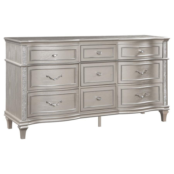 A silver oak finish creates an elegant touch to this glam nine-drawer dresser. Hexagon-shaped knobs and drop bail handles appointed with pearl accents adorn each of the nine spacious drawers for a luxurious look and feel. Keep delicate essentials organize