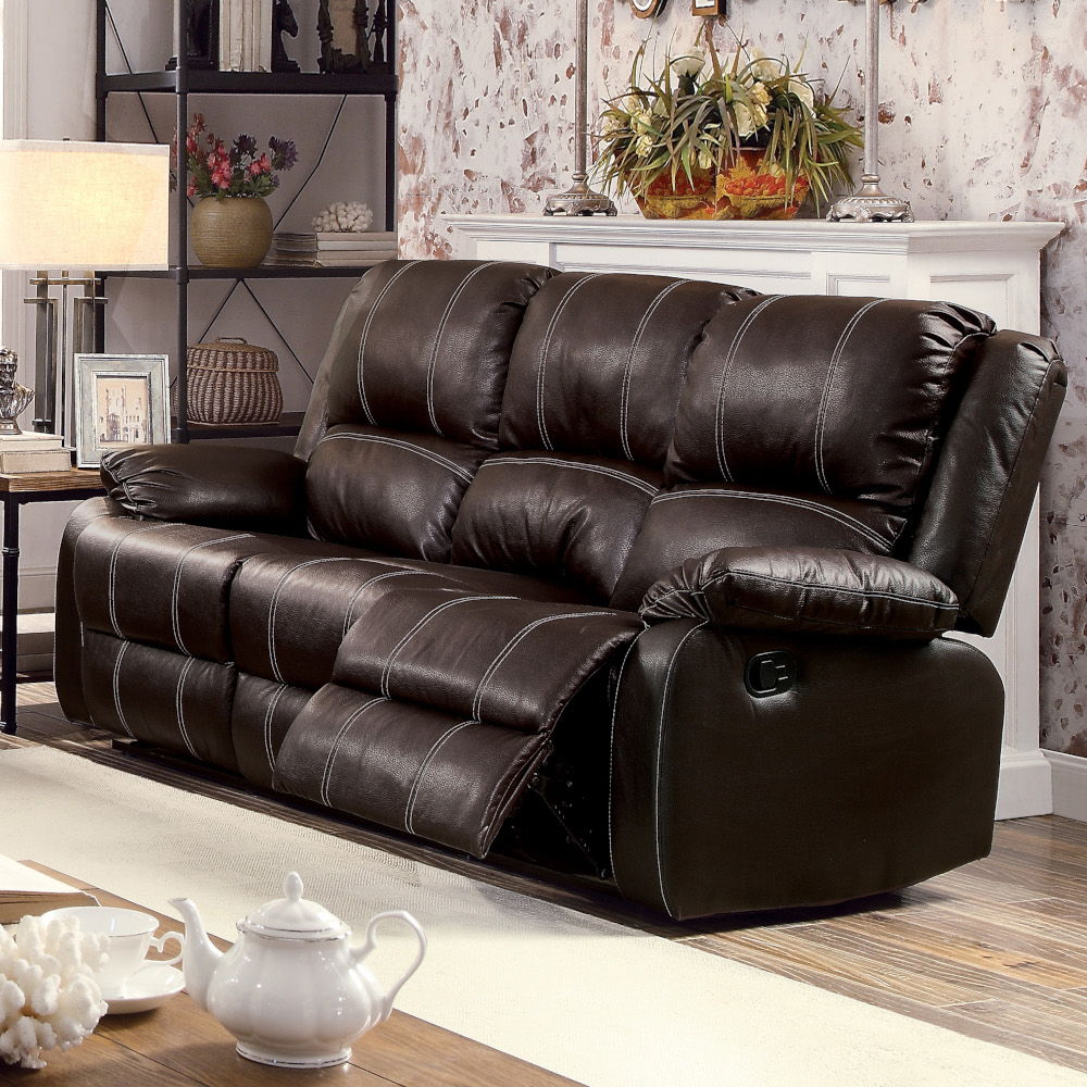 The Zuriel reclining sofa collection is a wonderful choice for any family room, combines luxurious faux leather with the comfort of padded, reclining seating. Comfortable contoured seats, soft to the touch while the reclining footrests offer full leg supp