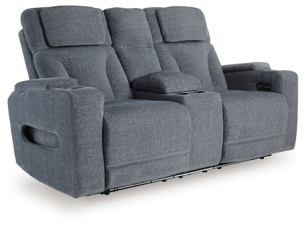 Chill-out time has never looked better. This power reclining loveseat-'s adjustable headrest ensures a perfect view of the TV no matter how far back you recline, while the extended ottoman takes your comfort to the next level. Handy charging features and 