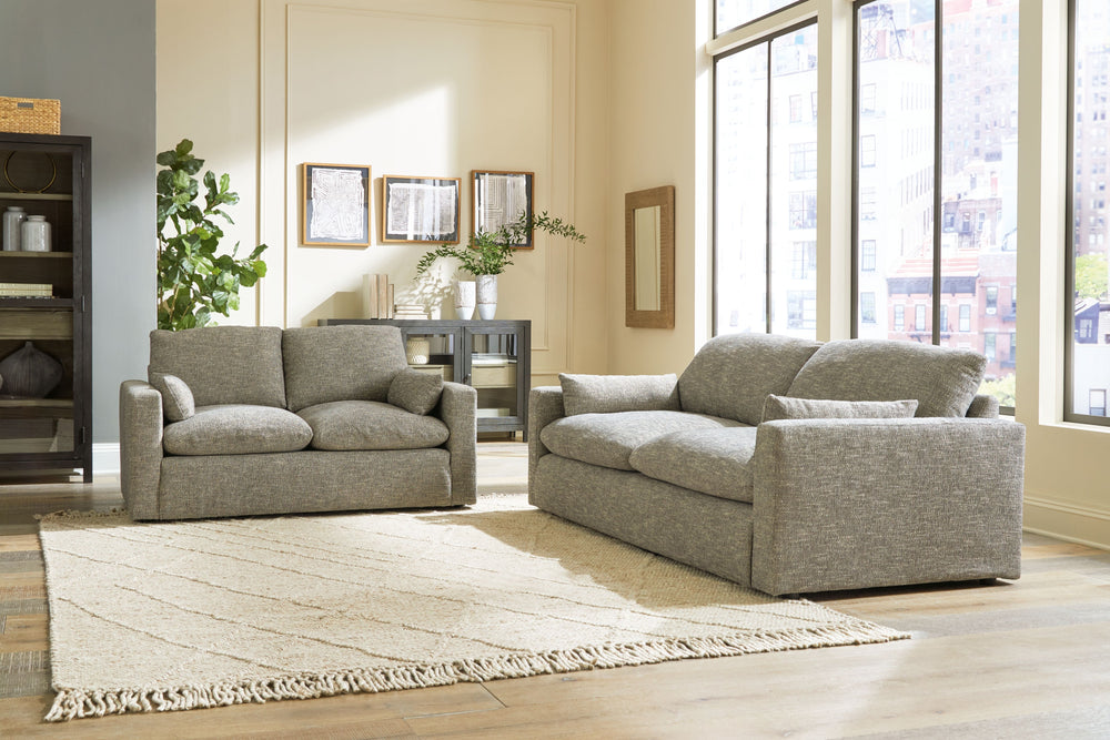 On the days when rest and relaxation seem out of reach, this sofa & loveseat provides a positively plush seating experience. Its feather-fiber blend cushions invite you to float away in cloud-like comfort. Striking granite-hued upholstery and a streamline