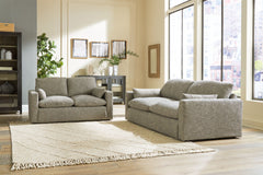 On the days when rest and relaxation seem out of reach, this sofa & loveseat provides a positively plush seating experience. Its feather-fiber blend cushions invite you to float away in cloud-like comfort. Striking granite-hued upholstery and a streamline