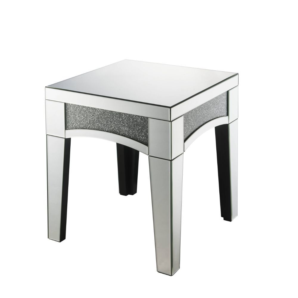 Brighten up your empty living room with the Nowles occasional table. This table offers a mirrored top and arched apron with faux stone inlay. The structure built from composite wood and mirrored panels covering every surface. A glam display table that nat