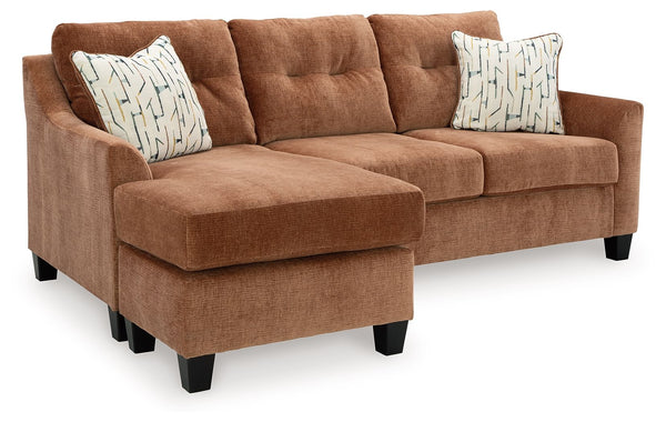 Urban contemporary meets mid century (with a pop of trend-right color) in this queen sofa chaise sleeper. Supremely soft upholstery, teeming with luster and movement, finesses the piece with just the right touch. Gently flared arms and tufted back cushion