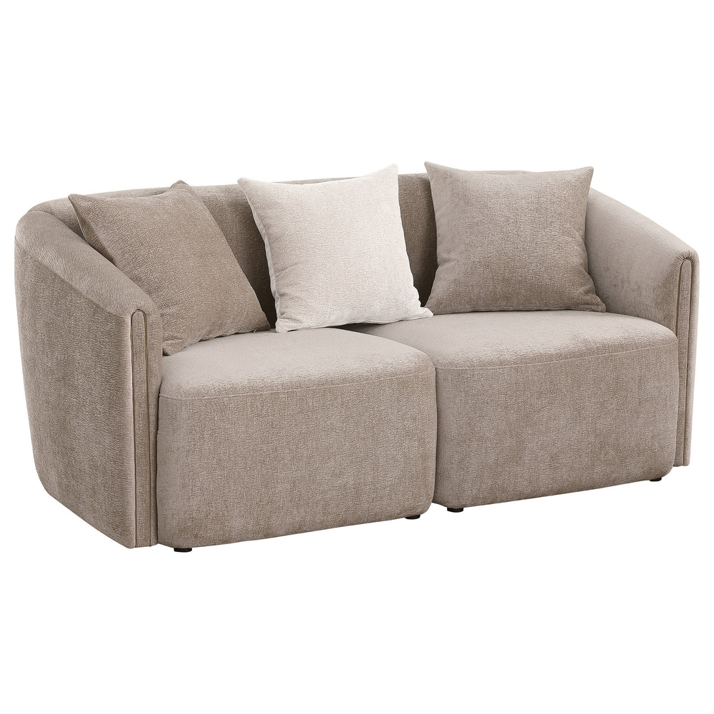 Augment living room seating with the inviting profile of a modern loveseat. Its curved shelter back and sloping arms establish a refined look and feel, while tailored upholstery offers curated appeal. The loveseat is upholstered in chenille with a neutral
